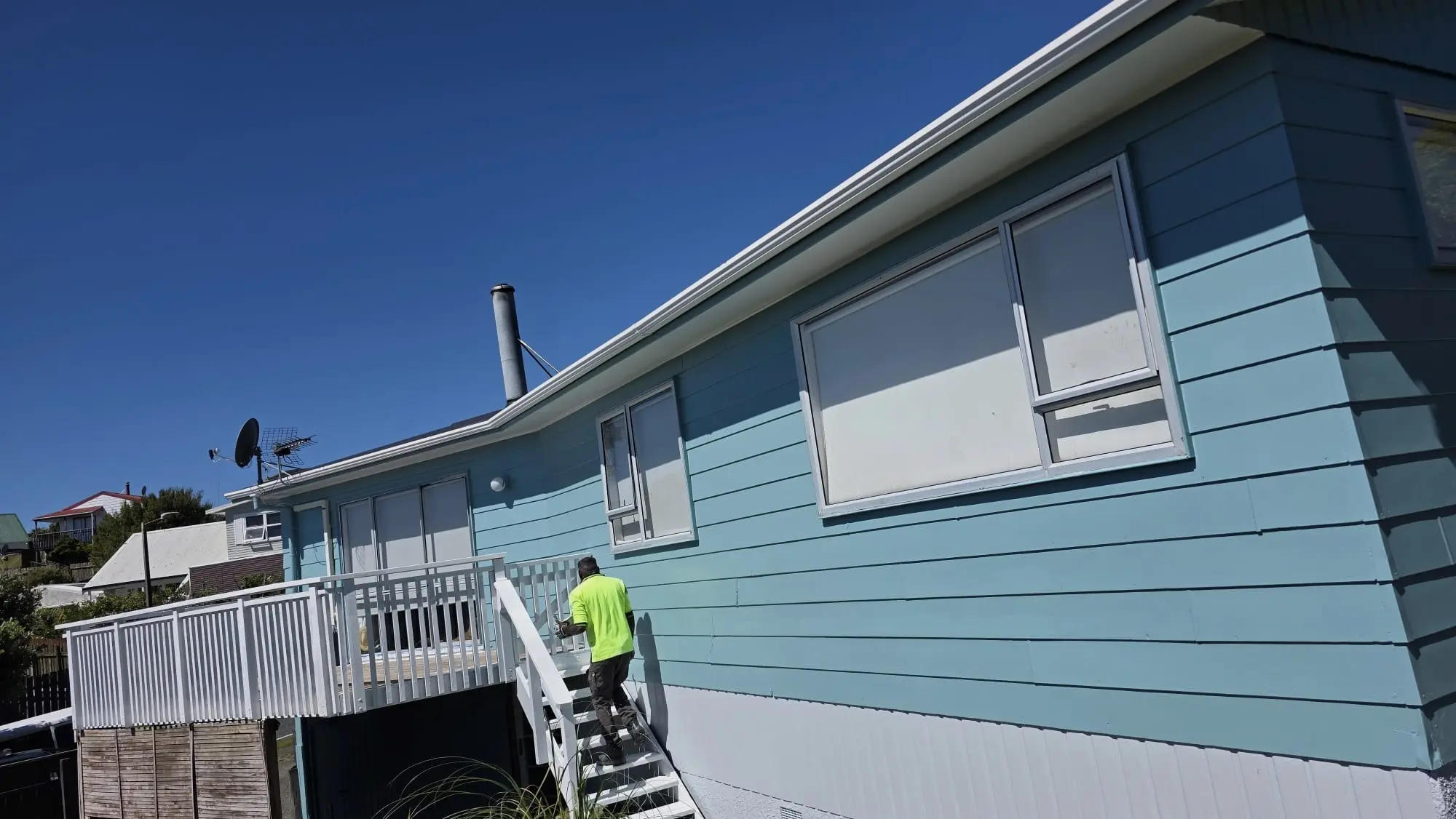 Professional painters working on a modern New Zealand home